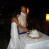 The couple cutting the weddin cake